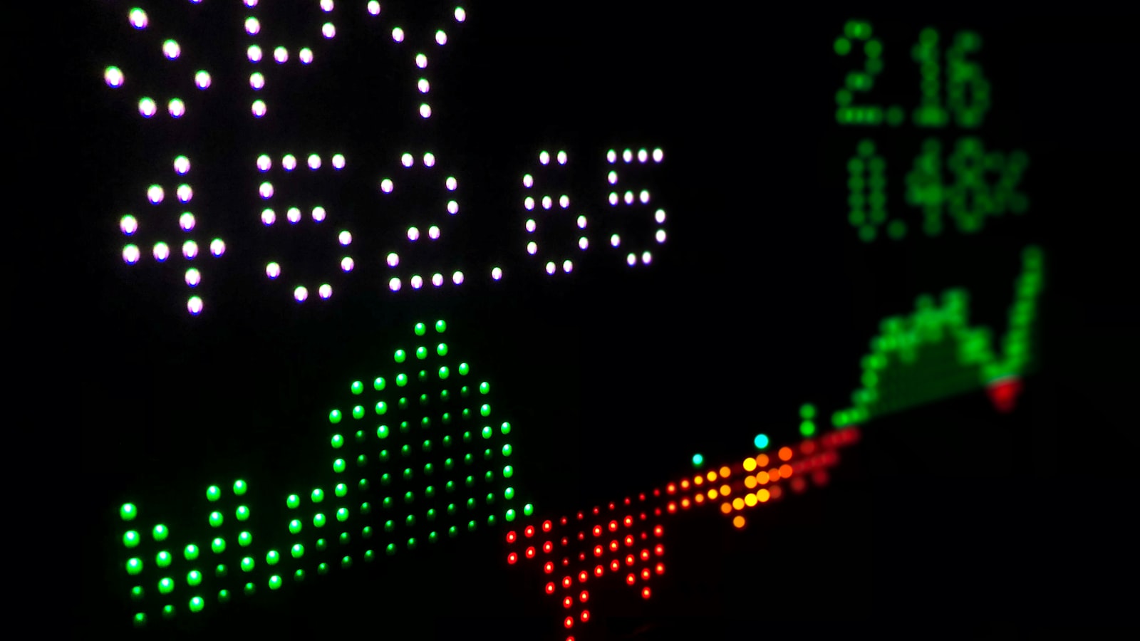 AI-generated illustration of a financial trading floor with cryptocurrency charts showing downward trends in blue and red lighting