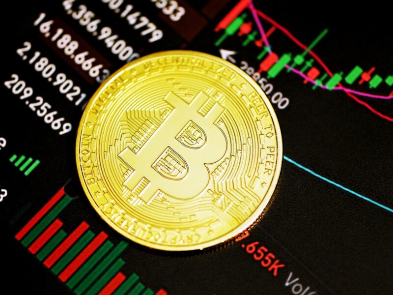 AI-generated illustration of a digital trading terminal showing a fear and greed gauge at extreme fear with red candlestick charts in the background