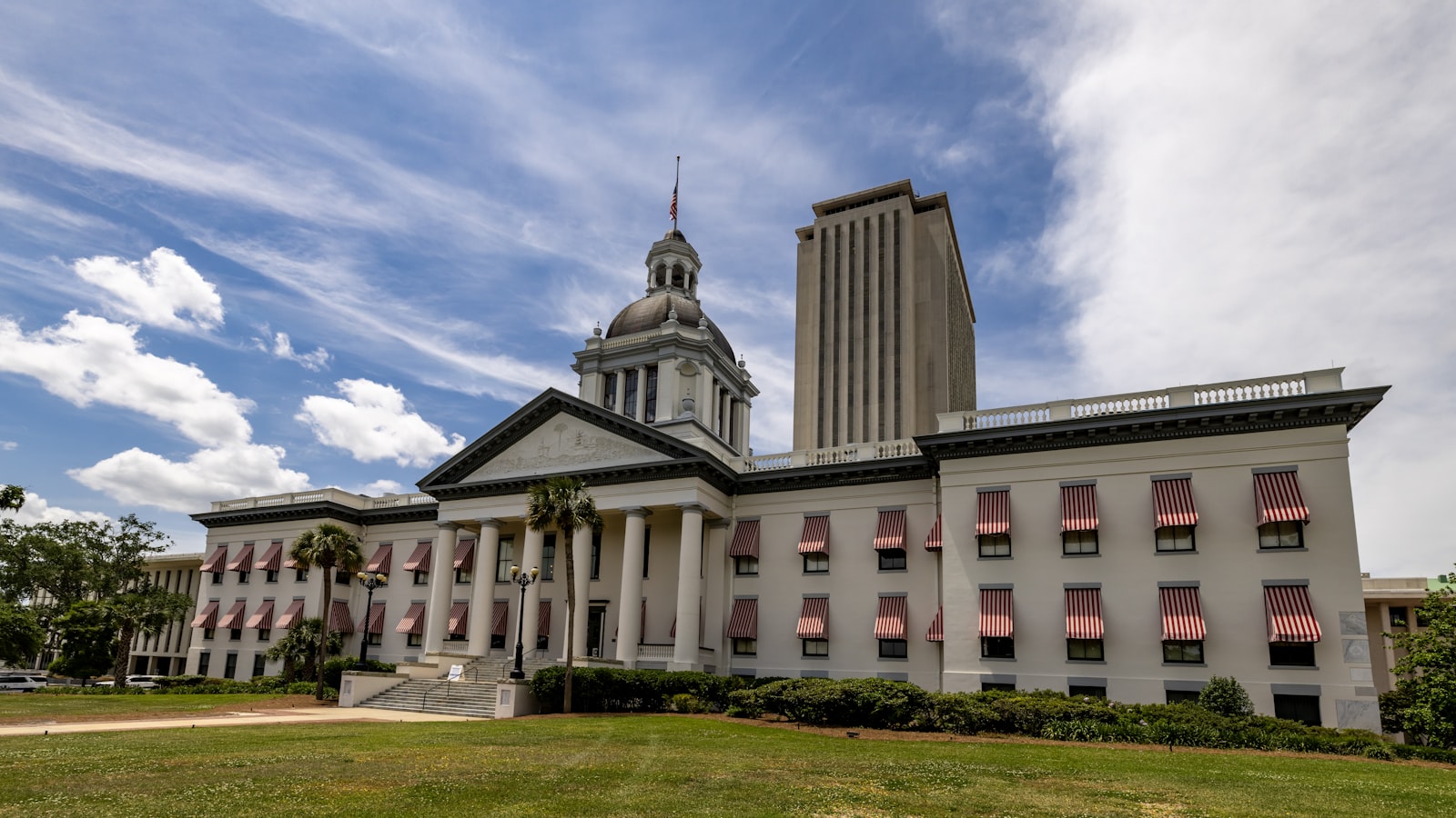 AI-generated illustration of a Florida state courthouse exterior at golden hour, with legal documents on marble steps representing a landmark AI lawsuit filing