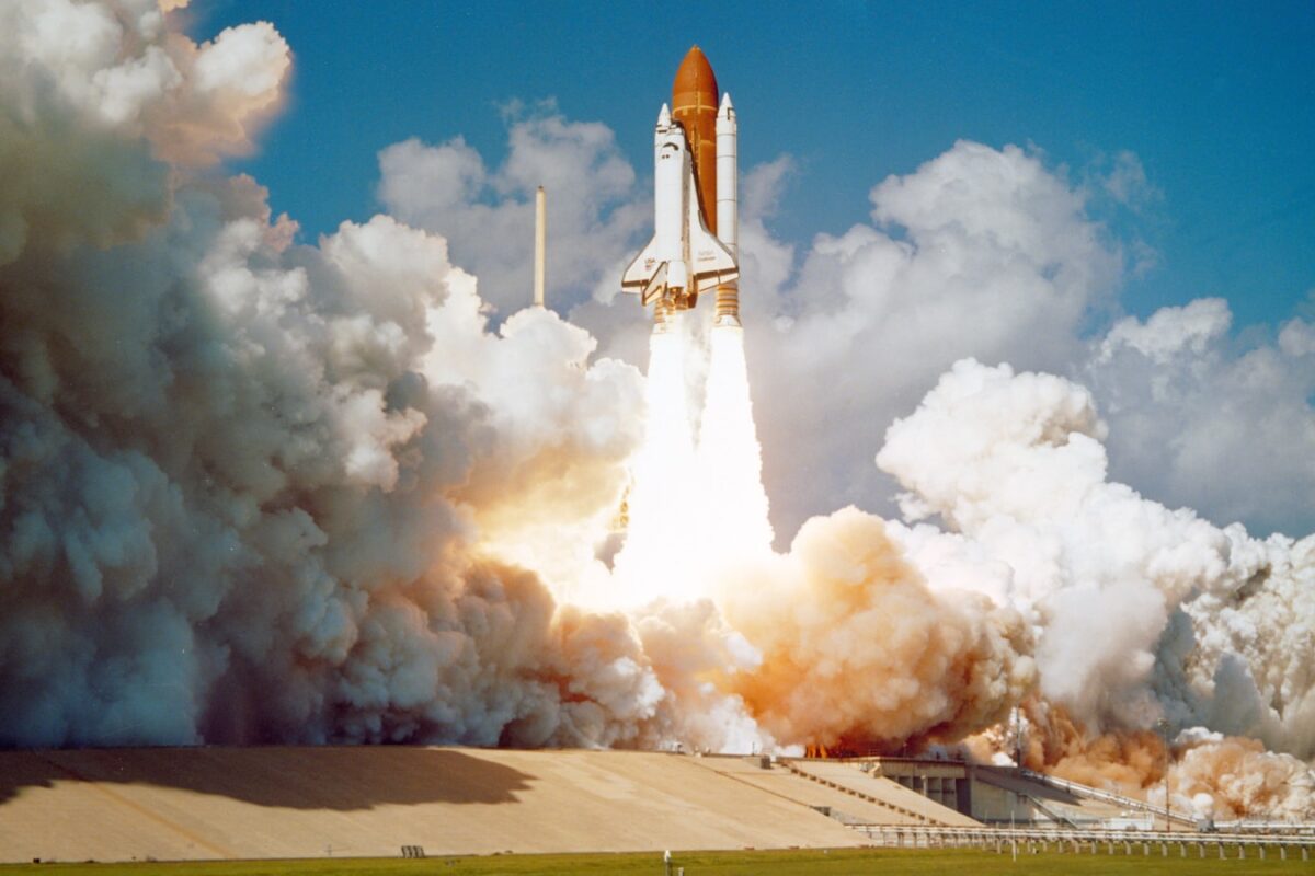 AI-generated illustration of a rocket launching at dusk with stock market chart overlays, symbolizing the SpaceX IPO buzz and its effect on space and chip ETFs
