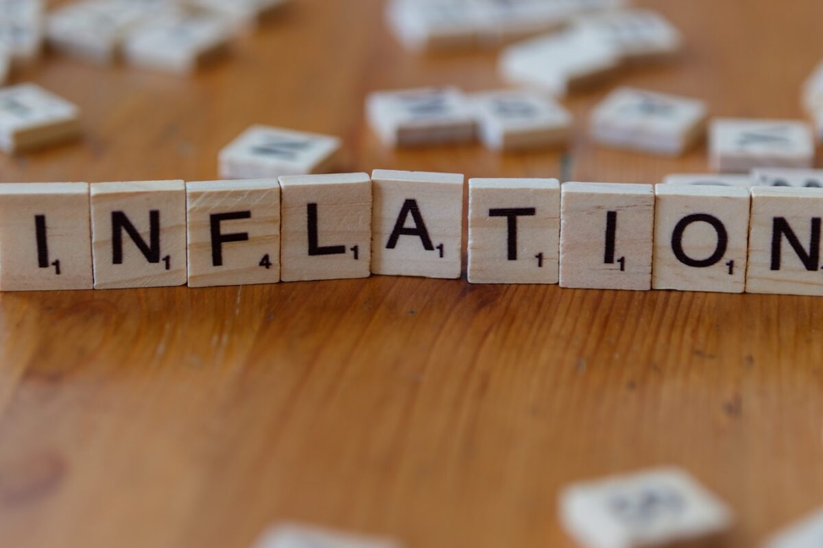 AI-generated editorial illustration of economic gauges showing rising inflation and falling growth, symbolising stagflation risk