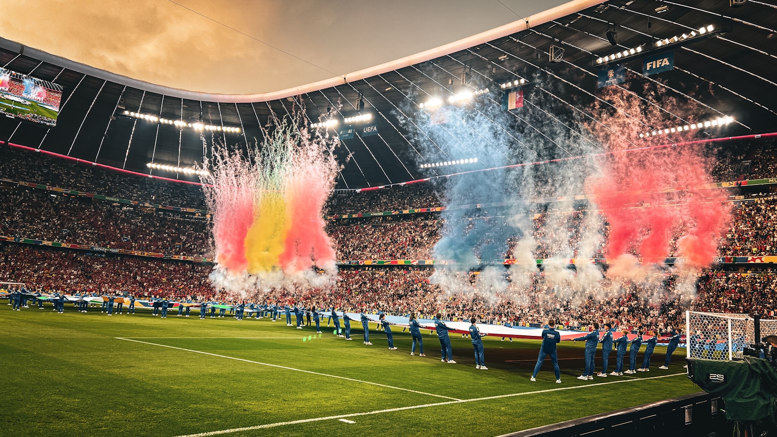 AI-generated illustration of a massive soccer stadium packed with fans from multiple nations under evening lights, representing the 2026 FIFA World Cup across three host countries
