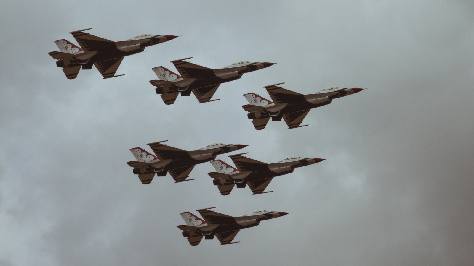 AI-generated illustration of fighter jets launching from a desert Gulf-state airbase at dusk, representing Gulf Arab military involvement in the Iran conflict