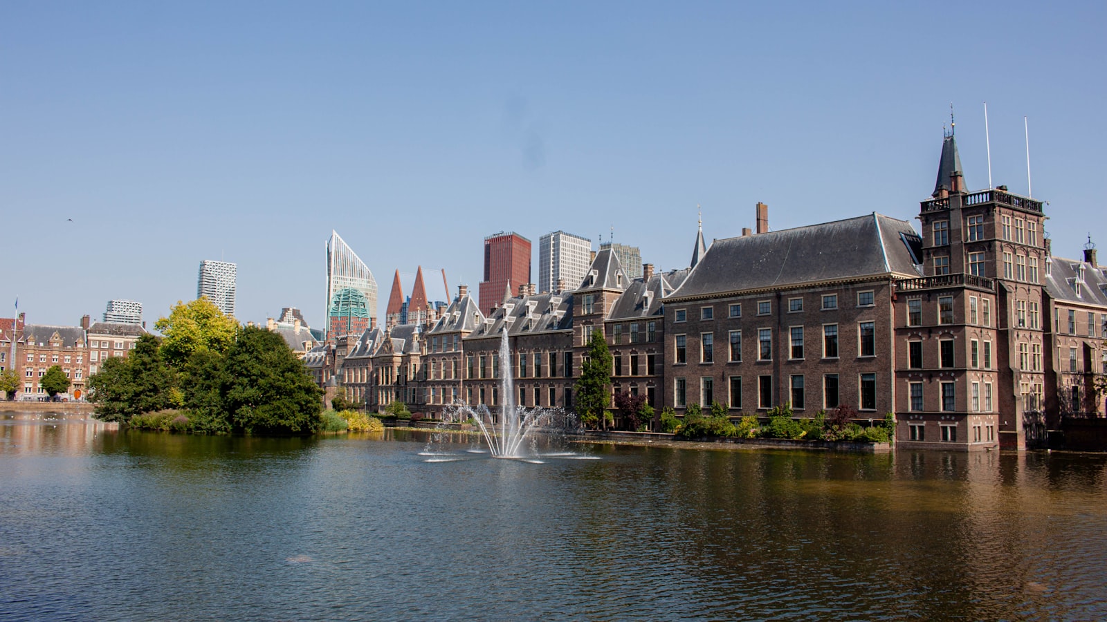 AI-generated illustration of the International Criminal Court building in The Hague on a gray overcast day, empty plaza in the foreground, austere institutional mood
