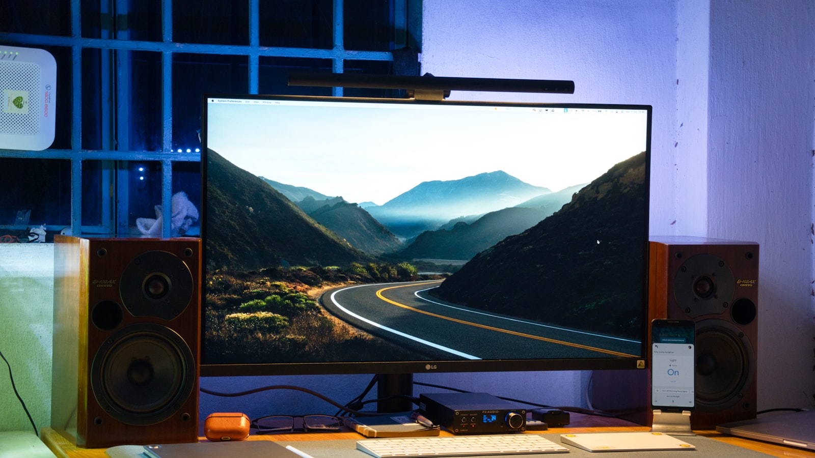 AI-generated illustration of a curved gaming monitor on a desk displaying an unwanted security software pop-up on a Windows 11 desktop, representing adware delivered via silent hardware install
